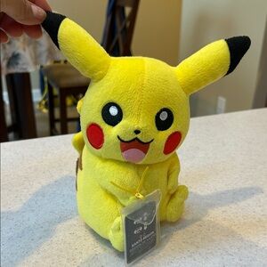Vibrant Yellow Pokémon Pikachu Plush with Black and Red Accents